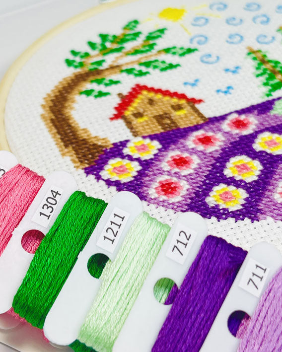 Summer cottage is box 1 of 5, the first design in our Seasonal Cottage Collection — a series of modern cross stitch hoop cottages to stitch and display through the year.